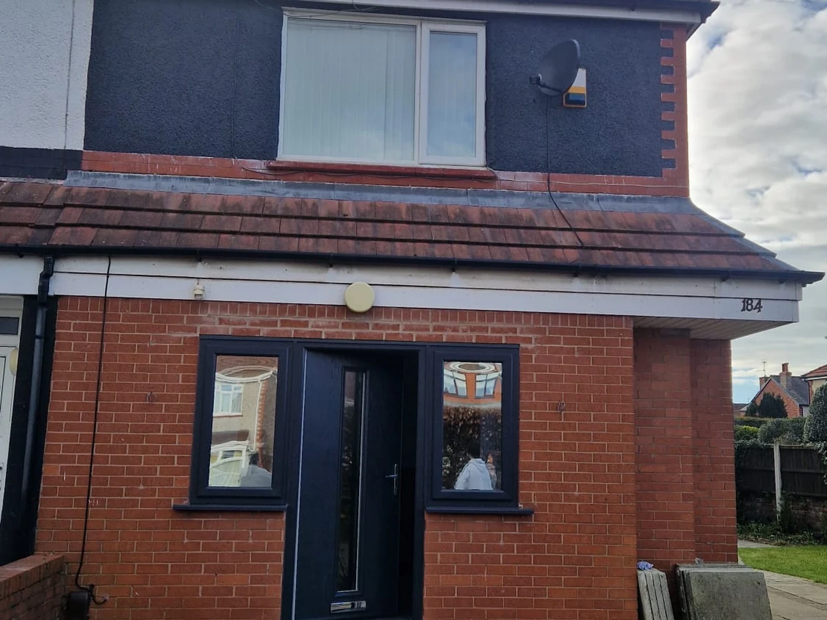 Exterior house painting — red brick with white trim in Preston by Rose Decor