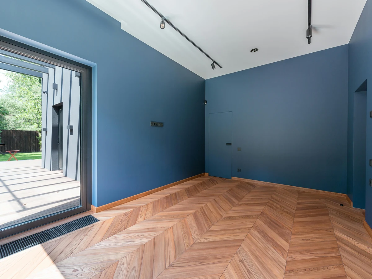 Interior Painting Preston - Rose Decor - Deep blue walls with white ceiling and herringbone floor