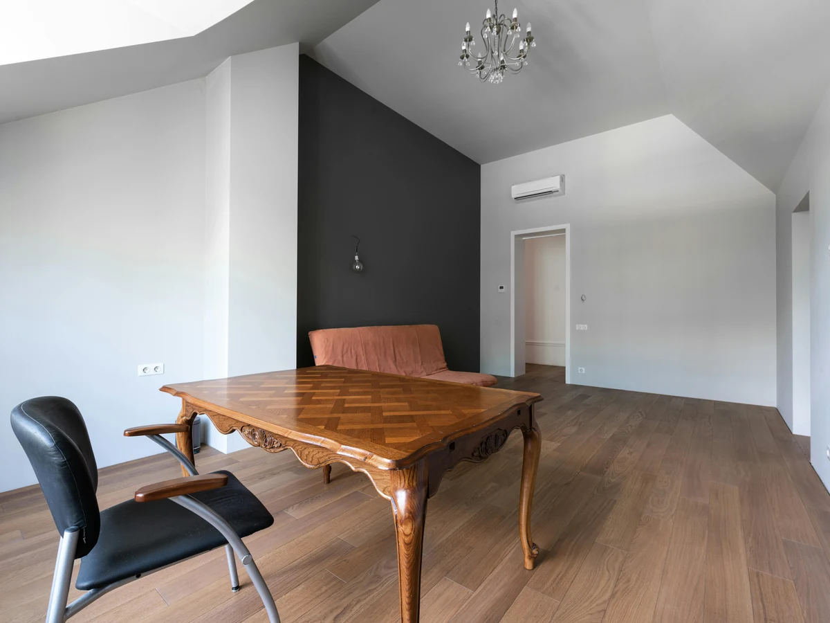 White and charcoal two-tone vaulted loft room after decoration in Preston by Rose Decor