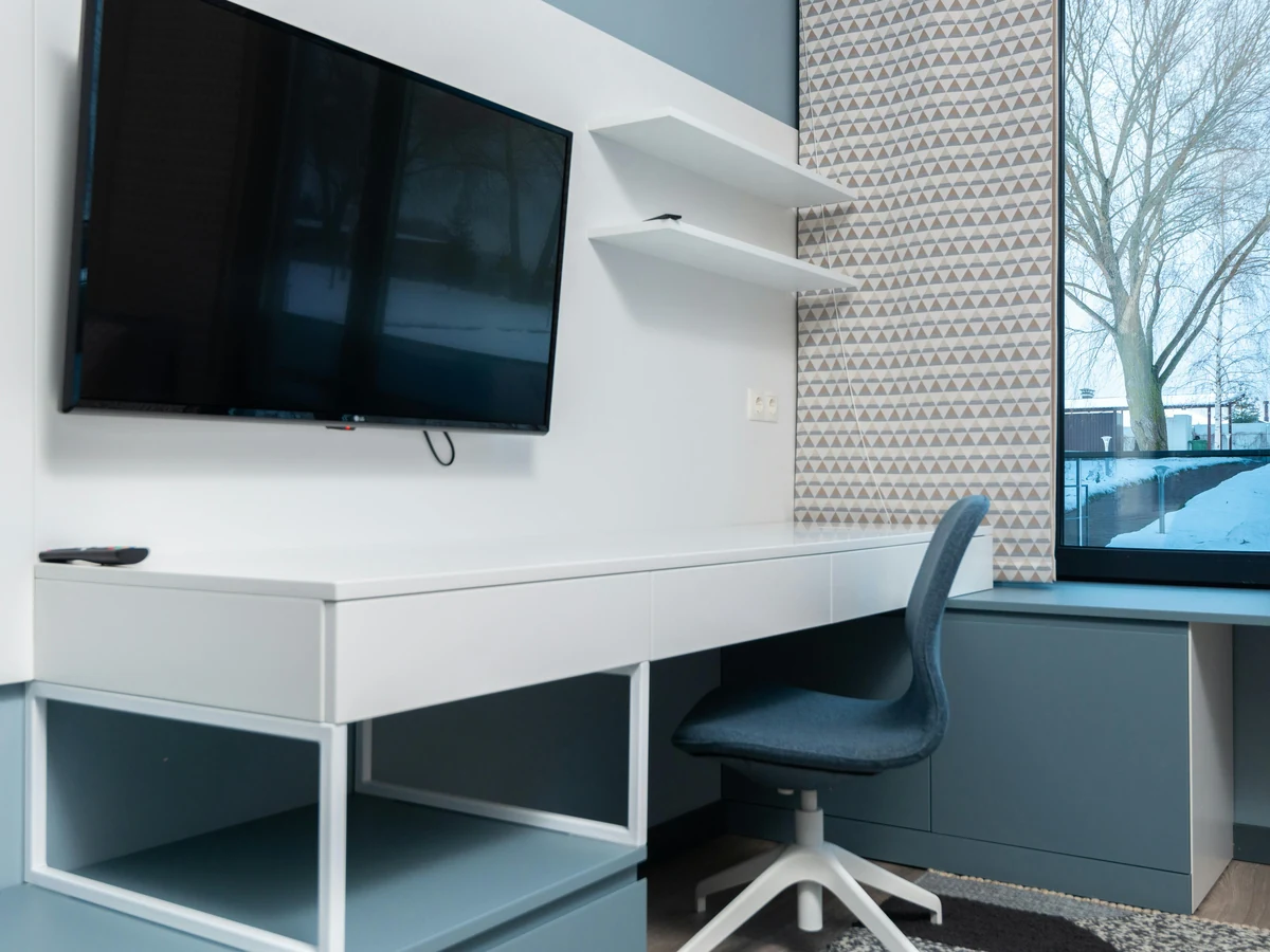 Patterned feature wall in a blue office room, Preston home office painting by Rose Decor